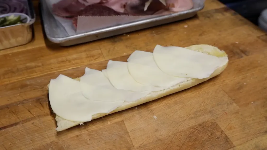how to make an italian sub sandwich step 1: provolone on bread