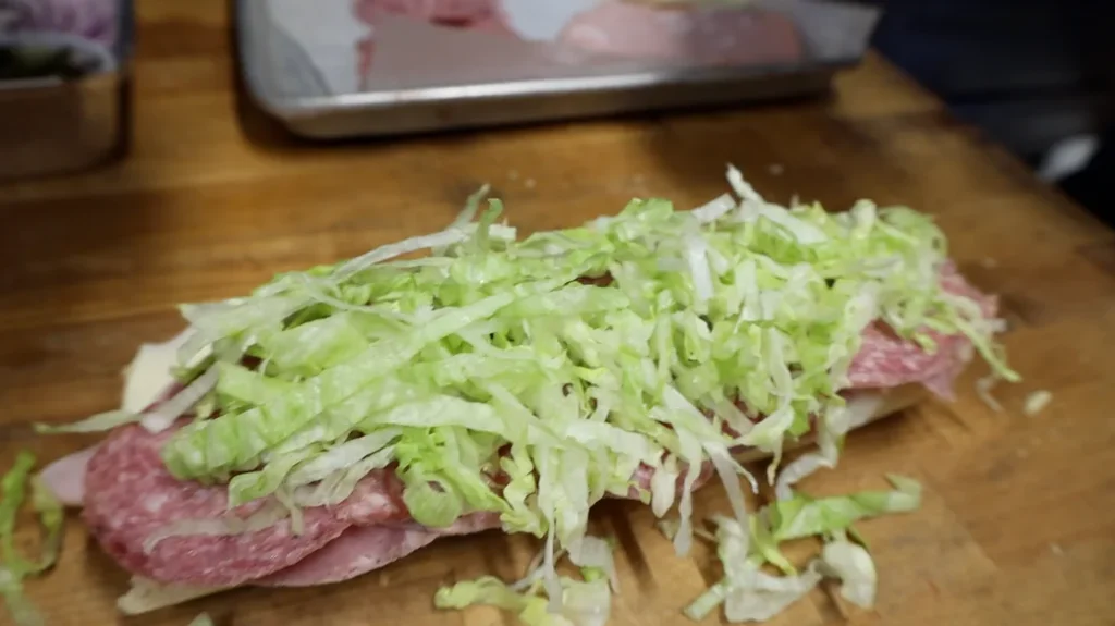 adding lettuce
