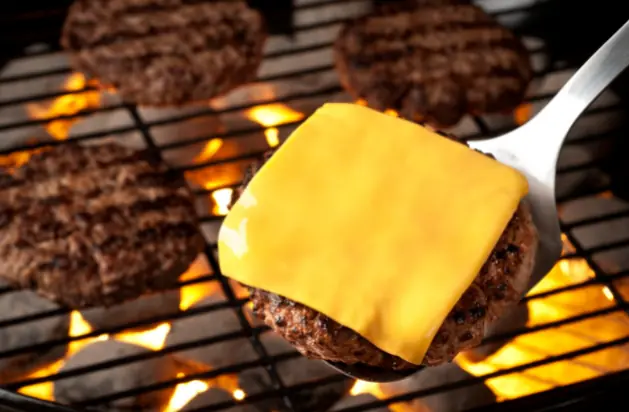 Close up of burger patty browning evenly