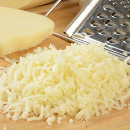 Measuring shredded mozzarella for pizza recipe