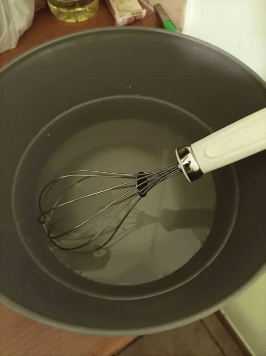 mixing lukewarm water and sugar