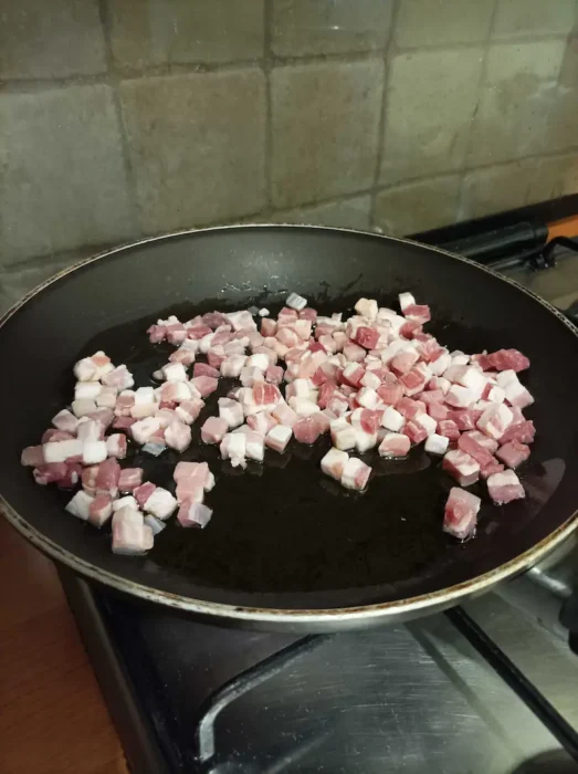 pancetta browning in a saucepan