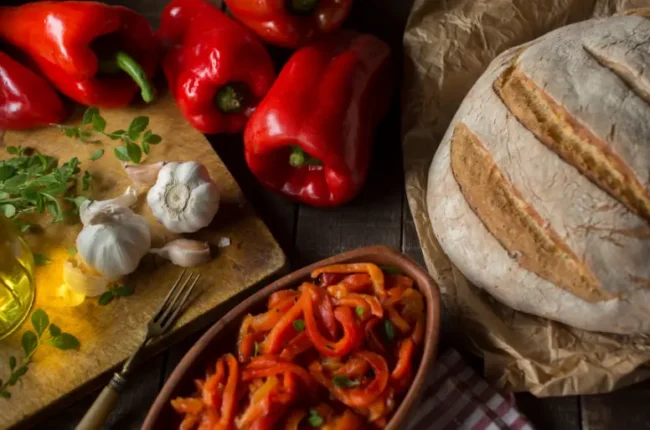 the ingredients for peperonata on a working surface