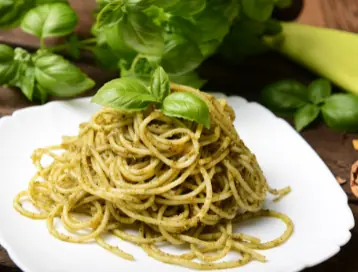 pesto pasta ready to be served with pinot wine