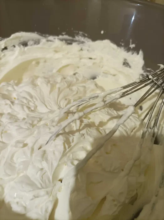 whipped heavy cream and spreadable cheese