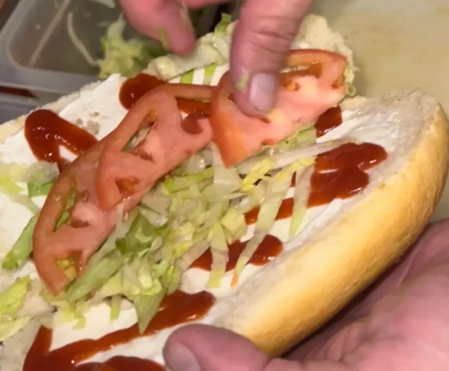 chopped cheese sandwich-adding iceberg lettuce and tomatoes