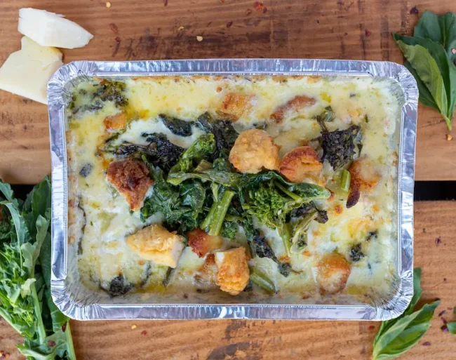 a lasagna with sauteed rapini