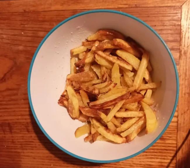 parmesan truffle fries in a small bowl