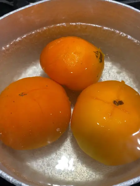 boiling fresh tomatoes for marinara sauce