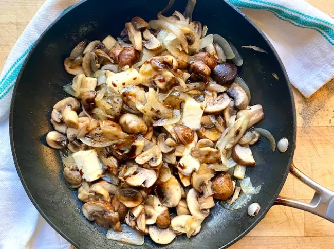 sauteeing mushrooms to make a burger