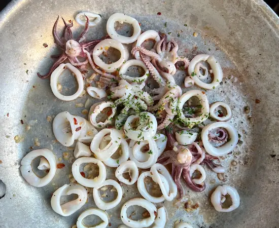 squid dishes-sauteeing squid in frying pan