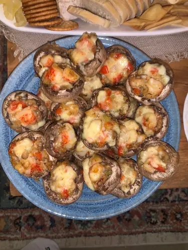 seafood finger food-mushrooms stuffed with gouda cheese and crabs are a perfect seafood appetizer for the holiday season