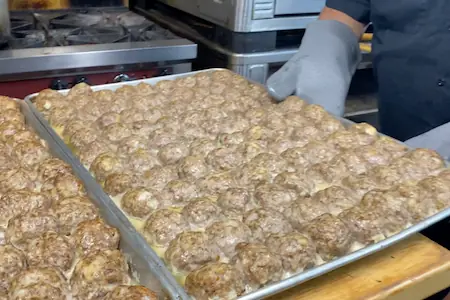 how long to cook meatballs in oven-baking trays full of meatballs