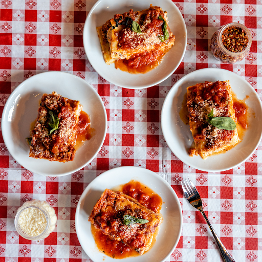 Slice of lasagna showing layered pasta and sauce