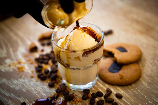 Iced coffee poured over fresh ice cubes