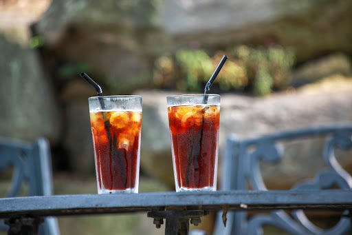 Two refreshing coffee drinks on a summer table