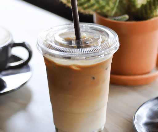 a tall iced oat milk latte