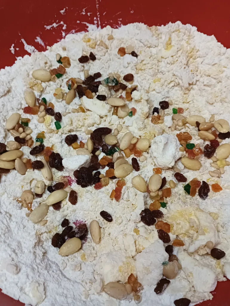 adding almonds and candied fruit
