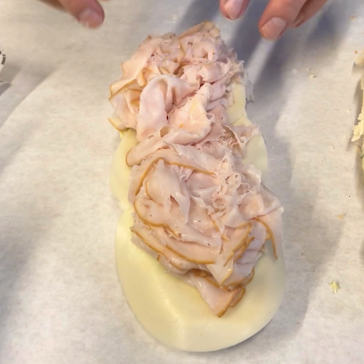 Adding sliced turkey