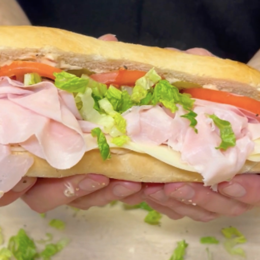 Ham and cheese sandwich on toasted bread with melted cheese