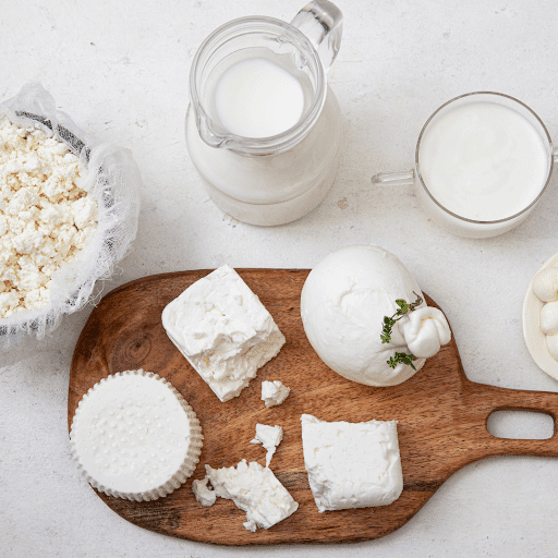 Sliced mozzarella cheese on cutting board