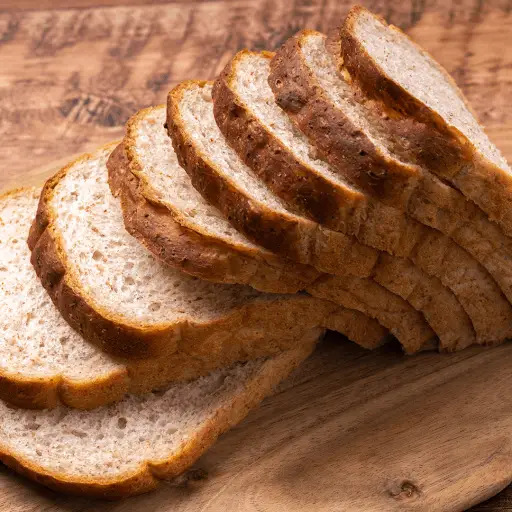 Stack of evenly cut bread slices on a plate